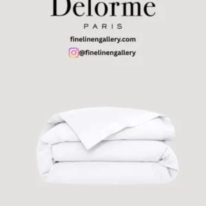Yves Delorme Adagio duvet cover in elegant fabric with intricate embroidery and classic design, displayed on a neatly made bed.