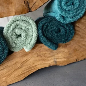 Abyss Habidecor Super Pile towels rolled.