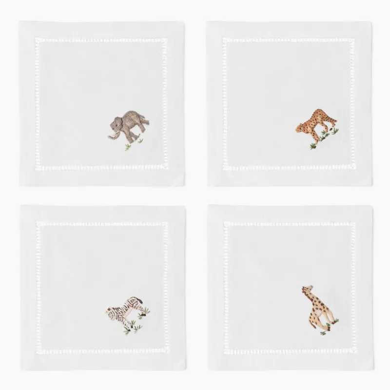 Henry Handwork white linen cocktail napkins with embroidered elephant, cheetah, zebra, giraffe.