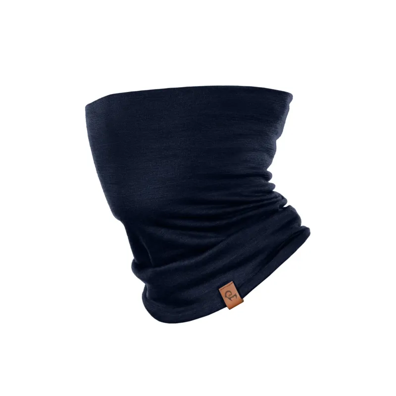 A dark navy blue tubular neck gaiter displayed against a solid white background. The soft fabric is styled with natural-looking folds and slouching, and a small, rectangular brown leather logo tag is attached near the bottom edge.
