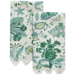Two folded Matouk Pomegranate linen guest towels with green and blue floral print and scalloped lace edges are displayed on a plain background.