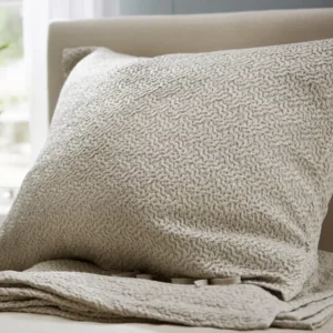 SDH Purists Allegro platinum jacquard decorative pillow on upholstered bed frame.