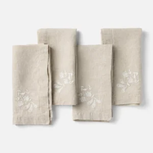 Coyuchi Verbena Embroidered napkin set of four in natural linen with white floral embroidery.
