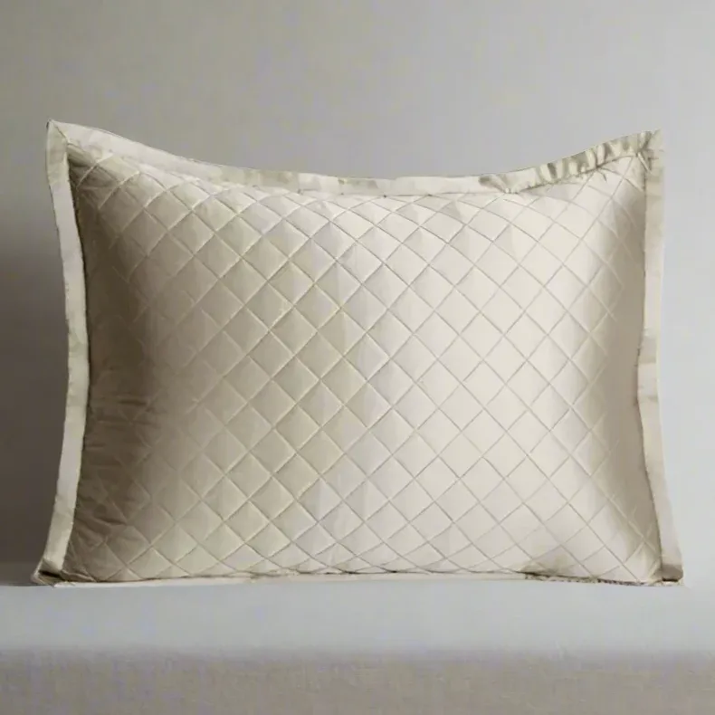 Kumi Kookoon ivory silk quilted pillow sham with diamond pattern and flange border.