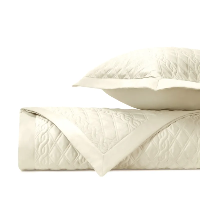 Home Treasures Abbey ivory quilted coverlet and euro sham set, folded.