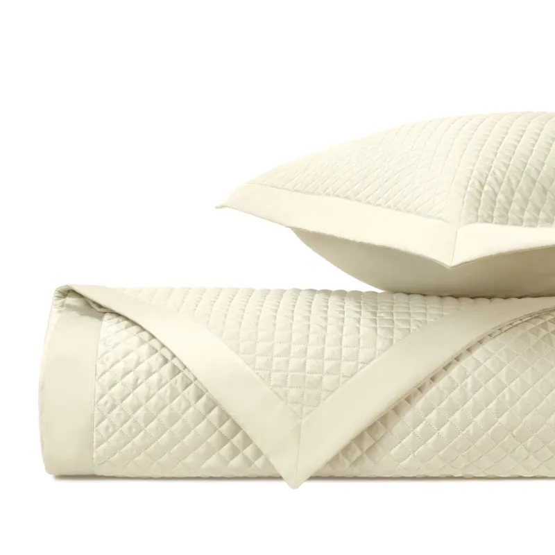 Home Treasures Diamond quilted coverlet and euro sham set in ivory with diamond stitching.