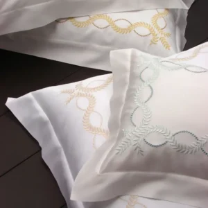 Dea Diana Embroidery fitted sheet in white with gold and sage leaf embroidery.