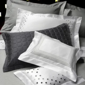Dea Minerva Embroidery white fitted sheet with grey geometric embroidery detail.