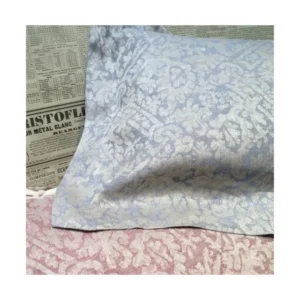Leitner Ranna powder blue damask jacquard pillowcase with floral pattern detail.
