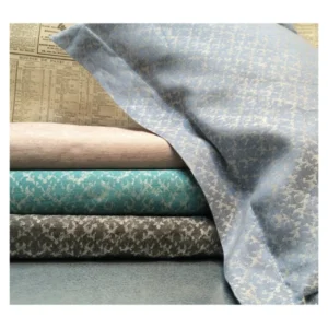 Leitner Wendling bed skirt panels in slate, teal, blush, and graphite damask linen.